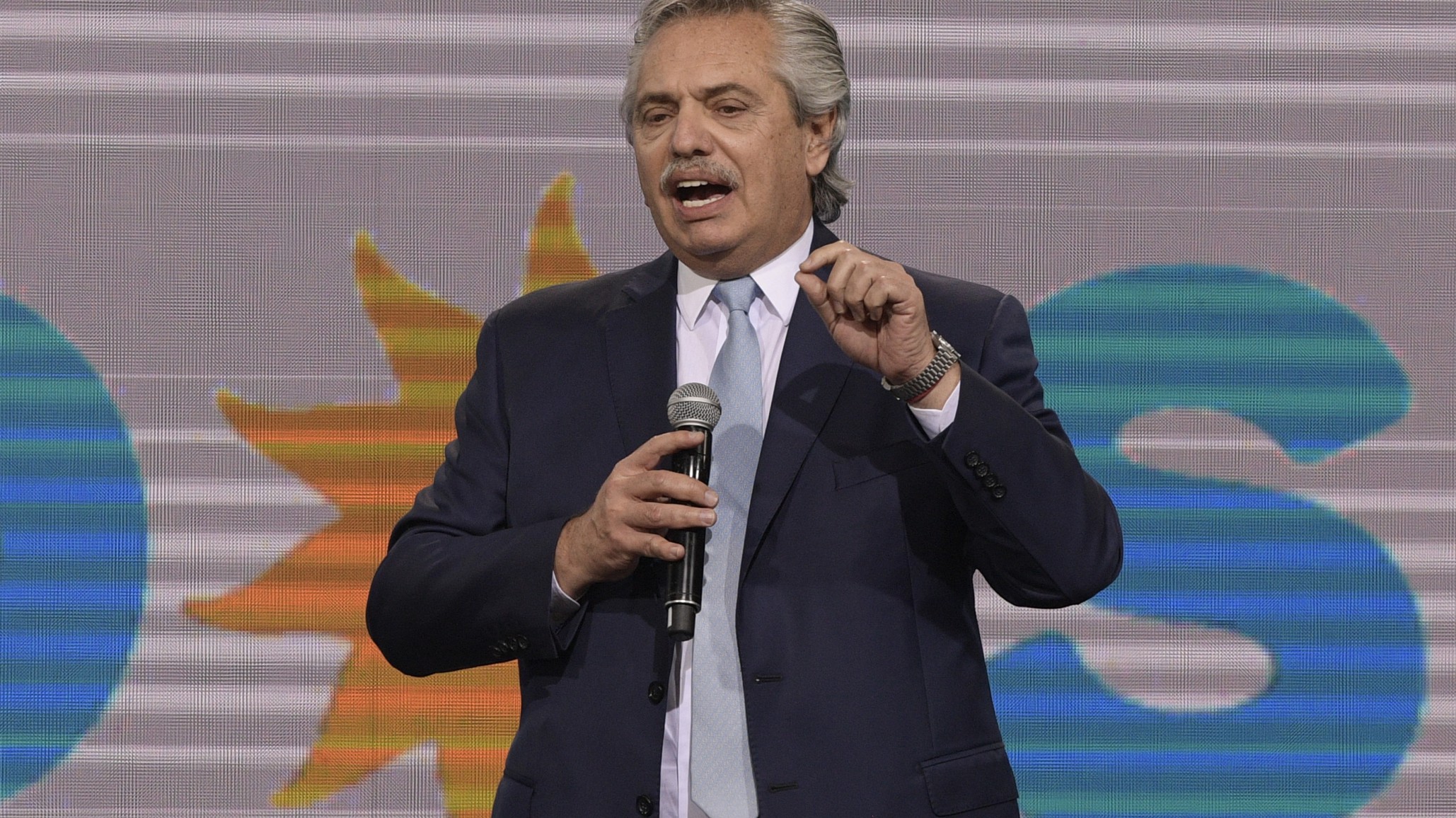 <p>Argentina’s President Alberto Fernandez gestures as he delivers a speech to the ruling party “Frente de Todos” voters after the mid-term parliamentary elections in Buenos Aires, on November 14, 2021. (Photo by JUAN MABROMATA / AFP)</p